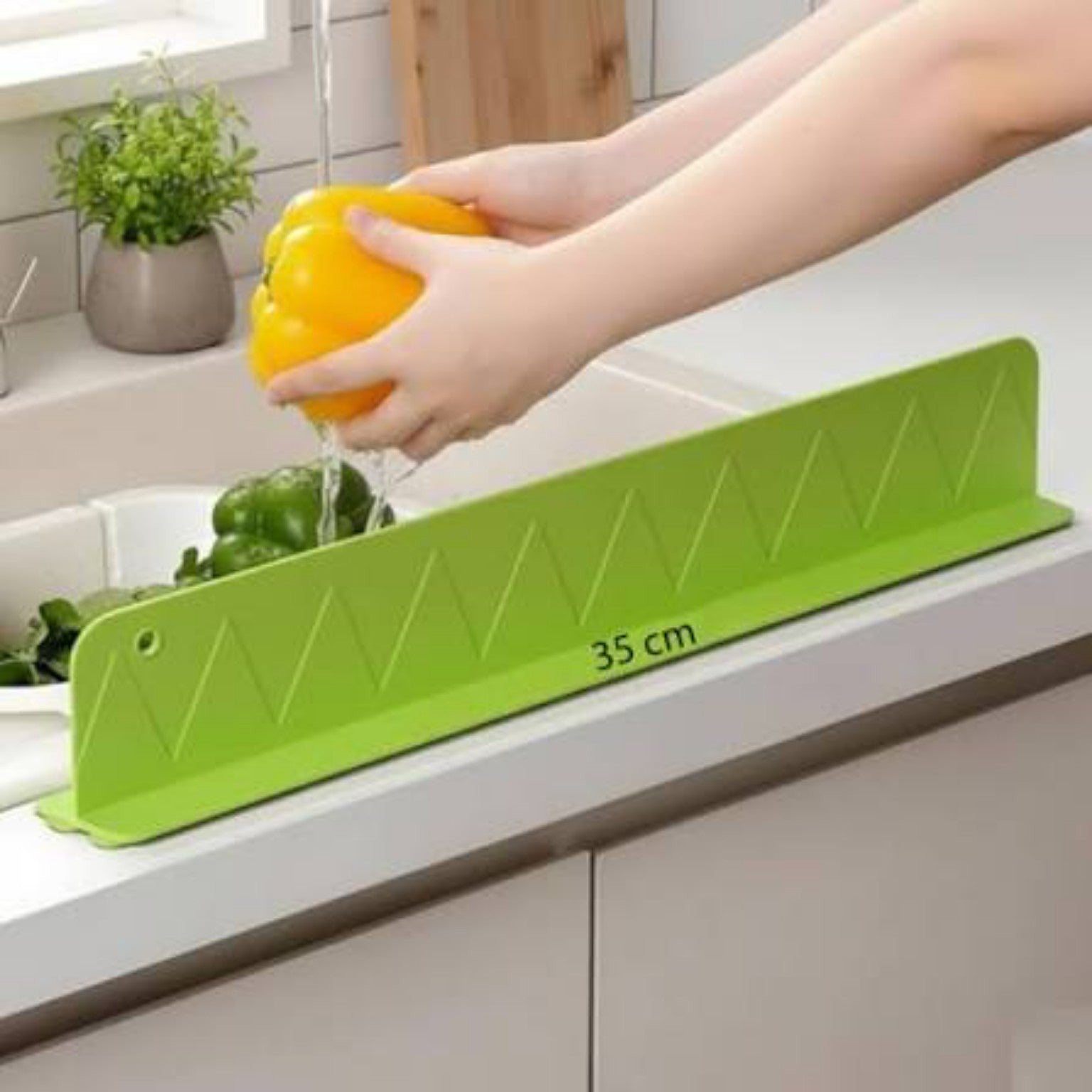 Kitchen splash guard in use
