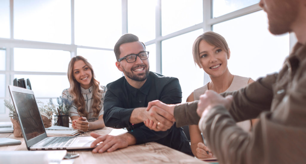 handshake business people at a meeting in the office